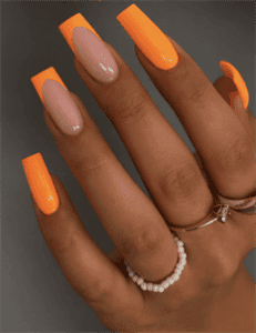 Neon orange French tip coffin nails with nude base, glossy long acrylic nail design