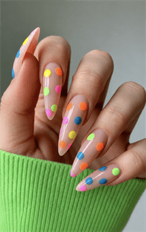 Neon polka dot jelly stiletto nails with translucent nude base, colorful glossy dotted nail design