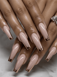 Nude coffin nails with rose gold chrome outline French tips, glossy minimalist nail design featuring metallic edge detailing