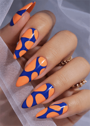 Orange and blue abstract stiletto nails with glossy finish, bold retro pattern nail design on long nails