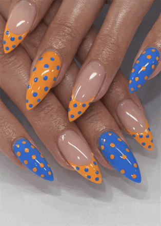 Orange and blue polka dot almond nails with glossy finish, colorful French tip nail design on nude base
