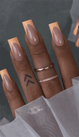 Peach French tip coffin nails with nude base, glossy minimalist acrylic nail design on long square nails