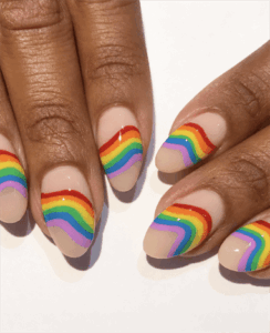 Rainbow swirl French tip almond nails with nude base, colorful retro wave nail design with glossy finish
