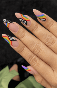 Rainbow zebra swirl almond nails with nude base, colorful abstract animal print nail design on long nails