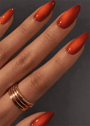 Red to orange ombre almond nails with glossy finish, fiery gradient nail design on long nails