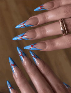 Retro blue flame stiletto nails with red outline accents, glossy nude base flame nail design on long nails