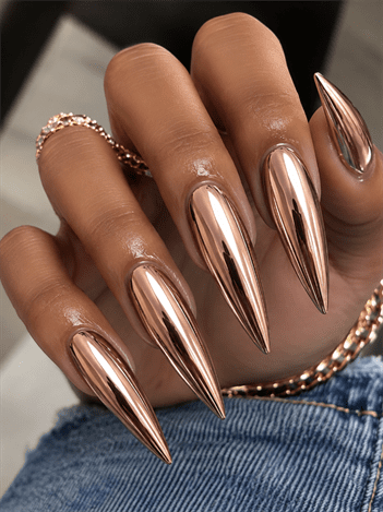 Rose gold chrome stiletto nails with mirror metallic finish, luxury reflective nail design on long pointed nails