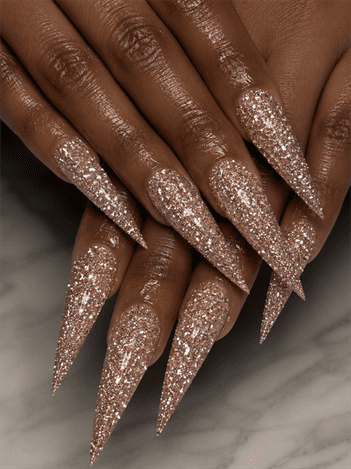 Rose gold glitter stiletto nails with full sparkle coverage, glamorous luxury nail design on long pointed nails