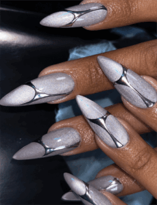 Silver chrome aura stiletto nails with metallic abstract accents, glossy holographic nail design on long nails