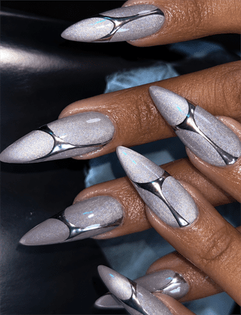 Silver chrome aura stiletto nails with metallic abstract accents, glossy holographic nail design on long nails