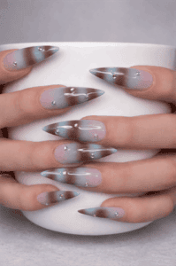 Smoky blue and brown ombre stiletto nails with rhinestones, glossy gradient nail design on nude base