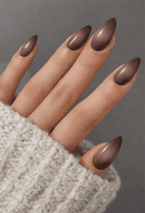 Smoky brown ombre almond nails with glossy gradient fade, soft neutral nail design on long nails