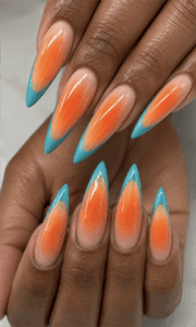 Sunset aura French tip stiletto nails with orange ombre center and turquoise blue tips, glossy tropical nail design on long pointed nails