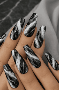 Black and white marble coffin nails with glossy finish, monochrome stone-inspired nail design on long acrylic nails