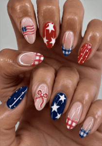 Americana patchwork nails with red, white and blue stars, plaid, polka dots and French tips, glossy patriotic nail design on almond nails