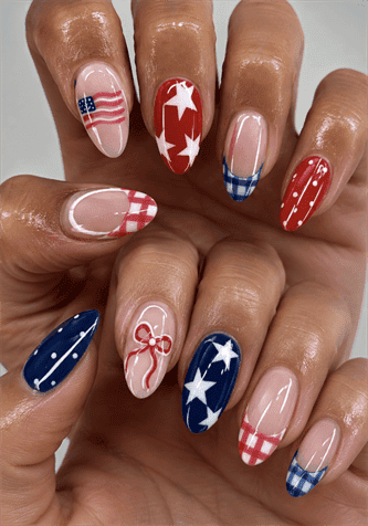 Americana patchwork nails with red, white and blue stars, plaid, polka dots and French tips, glossy patriotic nail design on almond nails