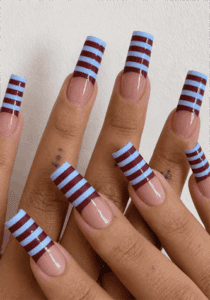 Burgundy and baby blue striped French tip coffin nails with glossy nude base, retro geometric nail design on long square acrylic nails