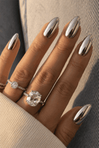 Mirror chrome almond nails with ultra-reflective silver metallic finish, glossy liquid chrome manicure and minimalist luxury nail design