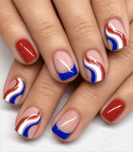 Patriotic retro wave short square nails featuring red, white and blue swirls, blue French tips and glossy minimalist Fourth of July nail art