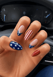 Patriotic stars and stripes almond nails with American flag nail art, glossy red, white and blue manicure for Fourth of July