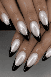 Pearl black French tip almond nails with iridescent white chrome finish, glossy black tips and elegant luxury manicure