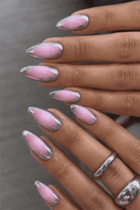 Pink chrome aura almond nails with reflective silver chrome outline, glossy metallic finish and soft blush gradient luxury manicure