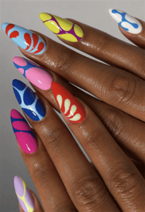Colorful abstract almond nails with retro geometric patterns, bold color blocking and glossy pop art nail design in pink, blue, red, lime and lavender