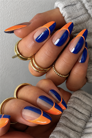 Royal blue and neon orange French tip almond nails with glossy finish, abstract color block nail design and modern summer manicure