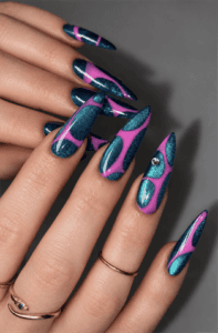 Teal glitter and hot pink abstract stiletto nails with geometric cutout nail art, glossy metallic accents and bold retro Y2K manicure