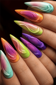 Rainbow aura stiletto nails with 3D sculpted gel swirls, glossy ombré gradients and colorful abstract luxury nail art