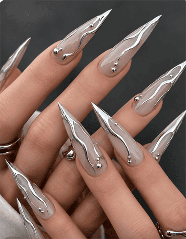 Silver chrome flame stiletto nails with liquid metal accents, glossy nude base and sculpted mirror chrome luxury nail design