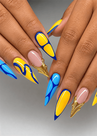 Blue and yellow abstract stiletto nails with geometric color blocking, gold chrome accents and glossy modern nail art on a nude base