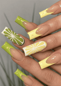 Lemon and lime citrus French tip coffin nails with 3D water droplets, glossy nude base and vibrant fruit-inspired summer nail art