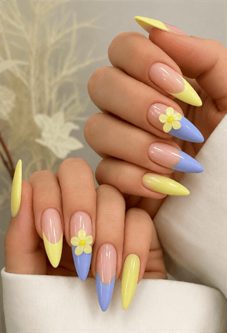 Pastel yellow and lavender French tip almond nails with 3D daisy flowers, glossy nude base and spring floral nail design