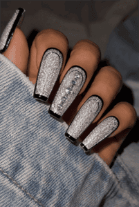 Silver glitter coffin nails with black outline French tips, sugar glitter finish, rhinestone accent nail and glamorous luxury manicure