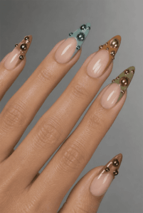 3D metallic bubble French tip almond nails with chrome sphere embellishments, glossy nude base and futuristic luxury nail design
