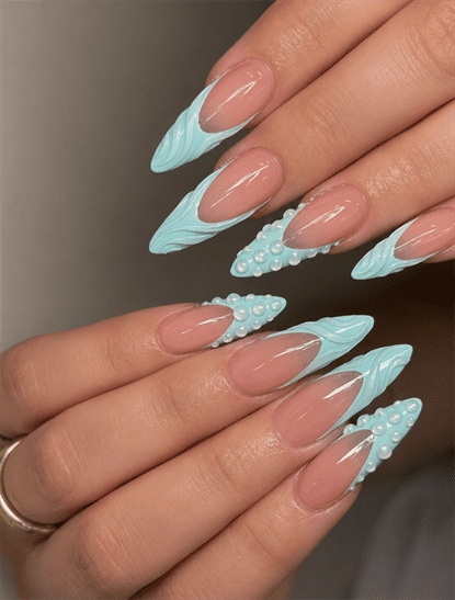 Aqua blue wave French tip stiletto nails with 3D pearl accents, sculpted ocean-inspired nail art and glossy nude base