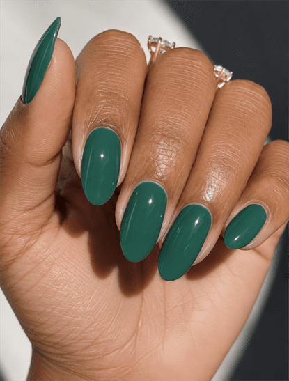 Glossy emerald green oval nails with solid jewel-tone polish, elegant minimalist manicure and timeless monochrome nail design