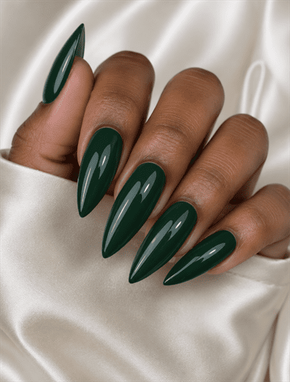 Glossy forest green stiletto nails with solid dark green polish, minimalist monochrome manicure and elegant luxury nail design