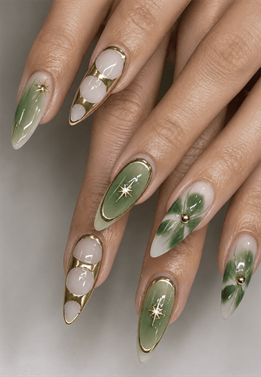 Sage green and gold celestial almond nails with floral nail art, metallic outlines, glossy finish and elegant luxury manicure