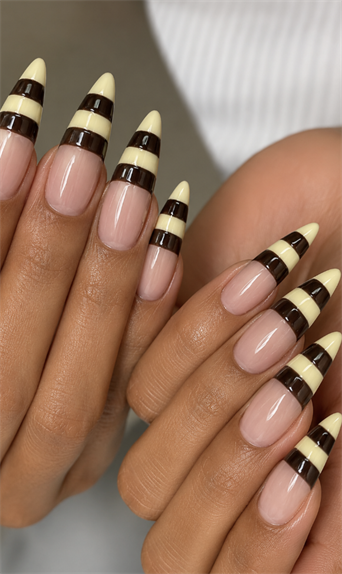 Chocolate brown and cream striped French tip almond nails with glossy nude base, minimalist dessert-inspired nail design and elegant neutral manicure