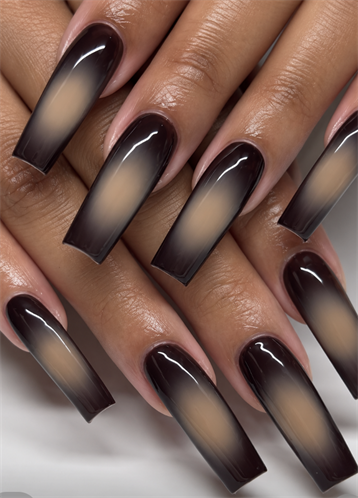 Extra-long coffin nails with glossy black smoky aura edges fading into soft nude centers