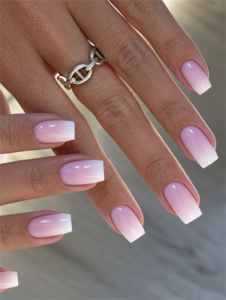 Pink and white ombré square nails with a soft French fade and glossy finish