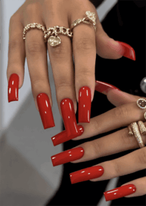 Classic red coffin nails with long square tips and a high-shine glossy finish