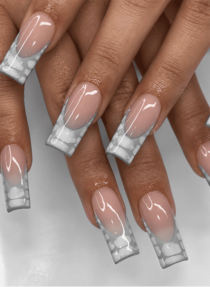 Nude and gray marble French tip coffin nails with white stone patterns and a glossy finish