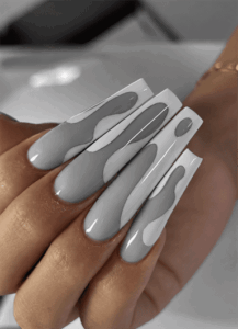Gray and white abstract wave coffin nails with layered swirl patterns and a glossy finish