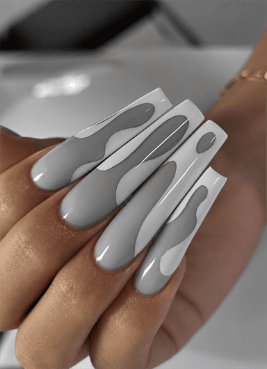 Gray and white abstract wave coffin nails with layered swirl patterns and a glossy finish
