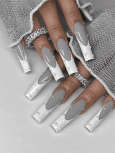 Gray and white drip coffin nails with raised pearl accents and a glossy finish