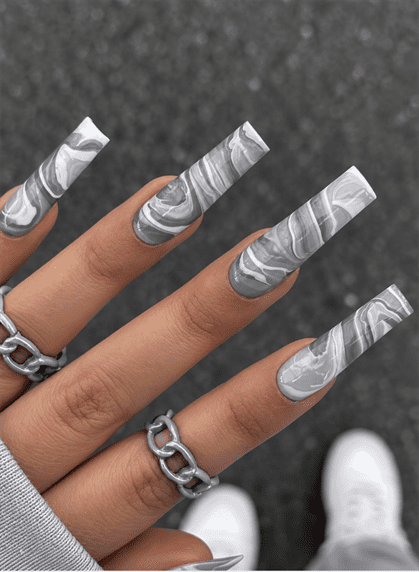 Gray and white marble coffin nails with smoky swirl patterns and a glossy finish