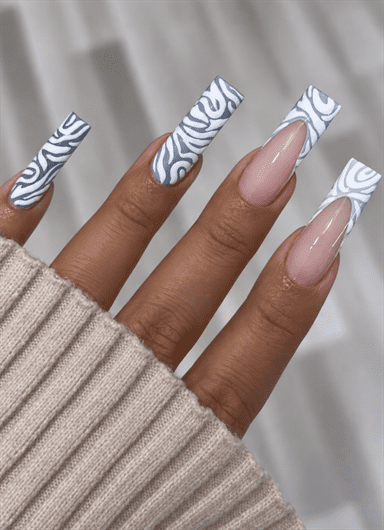 Gray and white zebra print coffin nails with nude accents, French tips and a glossy finish